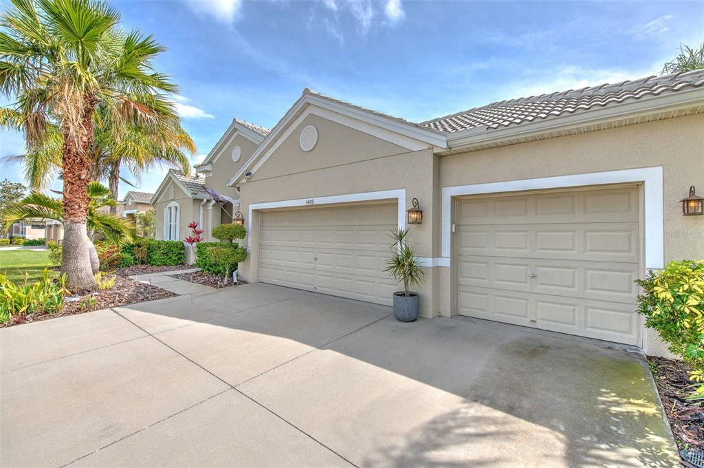 5409 Conch Shell Place Apollo Beach, FL 33572 - Photo 34 of 51 a front view of a house with a garage