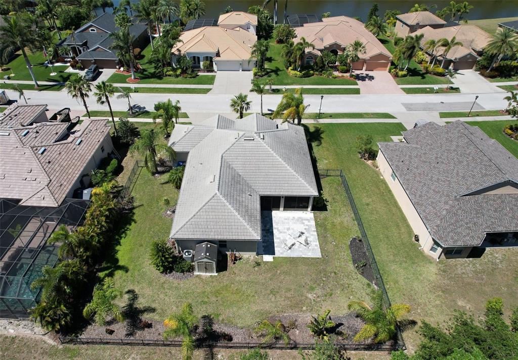 5409 Conch Shell Place Apollo Beach, FL 33572 - Photo 35 of 51 an aerial view of a house with a garden and lots of trees