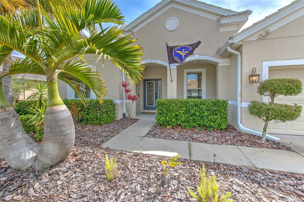 5409 Conch Shell Place Apollo Beach, FL 33572 - Photo 40 of 51 a front view of a house with garden