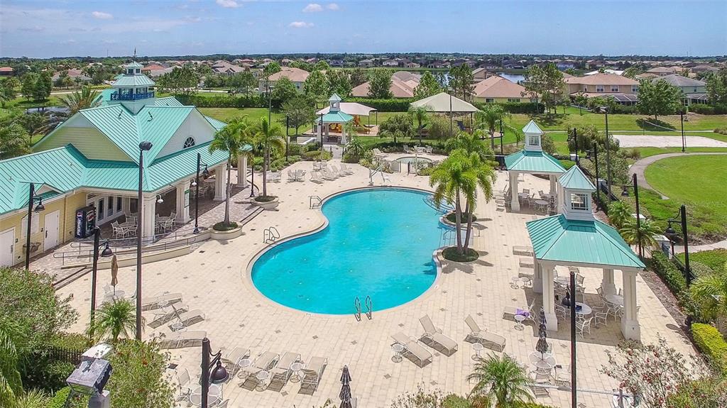 5409 Conch Shell Place Apollo Beach, FL 33572 - Photo 44 of 51 an aerial view of a house with a swimming pool patio and mountain view