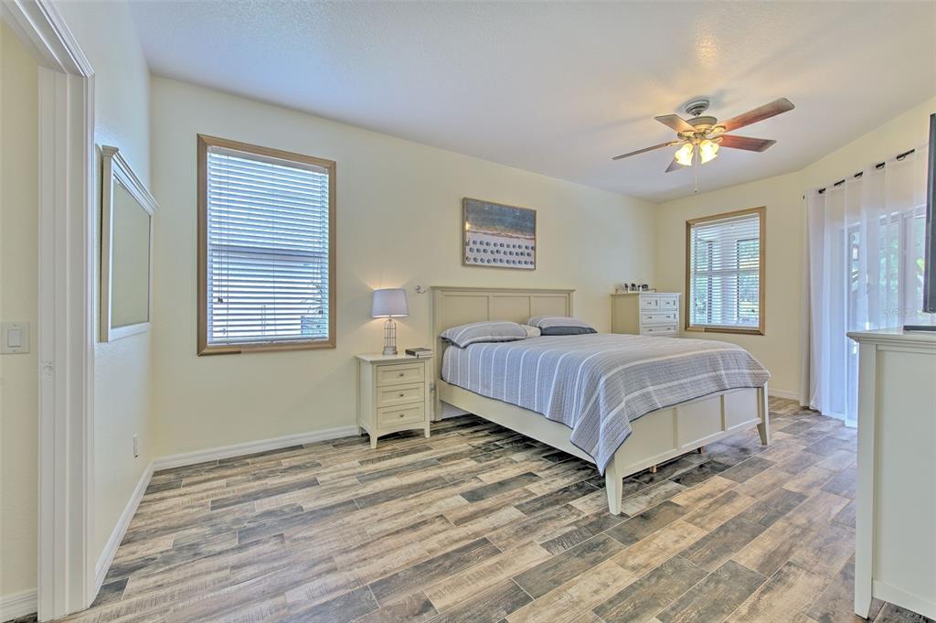 5409 Conch Shell Place Apollo Beach, FL 33572 - Photo 9 of 51 a bedroom with a bed and a chandelier