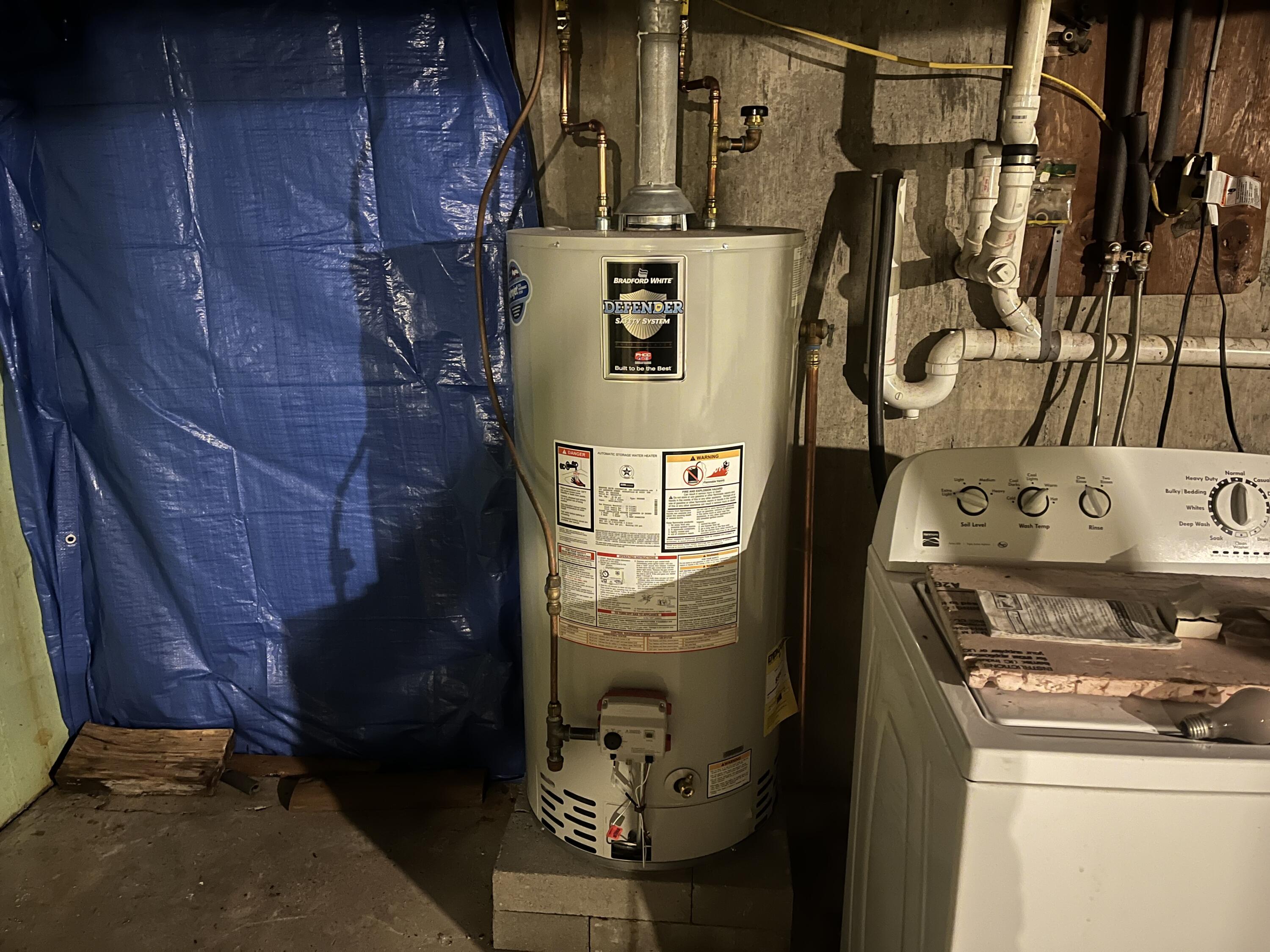 1347 Woodland Center Road Woodland, ME 04736 - Photo 30 of 50 Bulkhead Exit & Water Heater