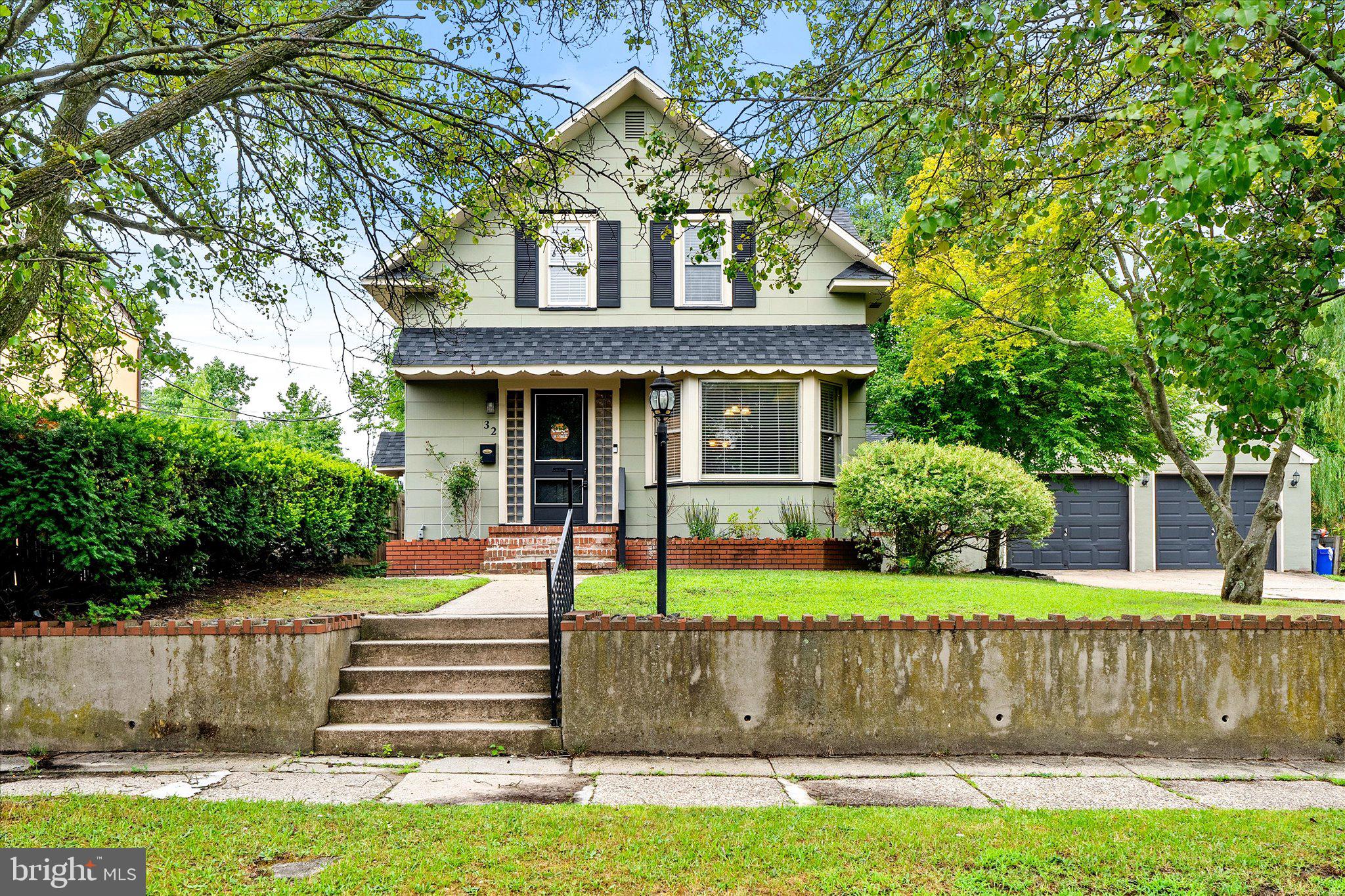 32 Lincoln Avenue Clementon, NJ 08021 - Photo 1 of 32 Charming home with lush greenery.