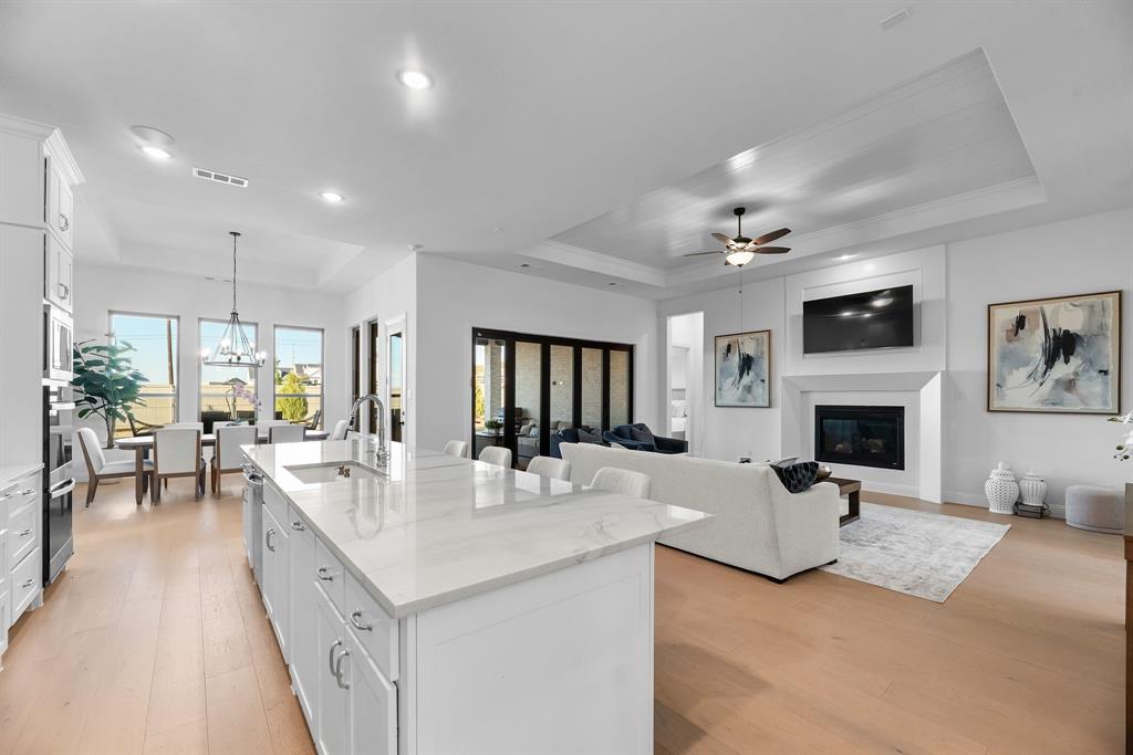 2248 Meander Way Northlake, TX 76247 - Photo 14 of 40 a living room with fireplace furniture and a flat screen tv