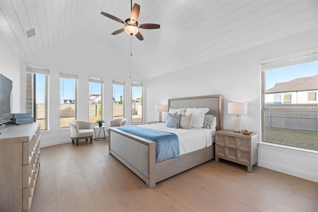 2248 Meander Way Northlake, TX 76247 - Photo 16 of 40 a spacious bedroom with a bed couch and a window