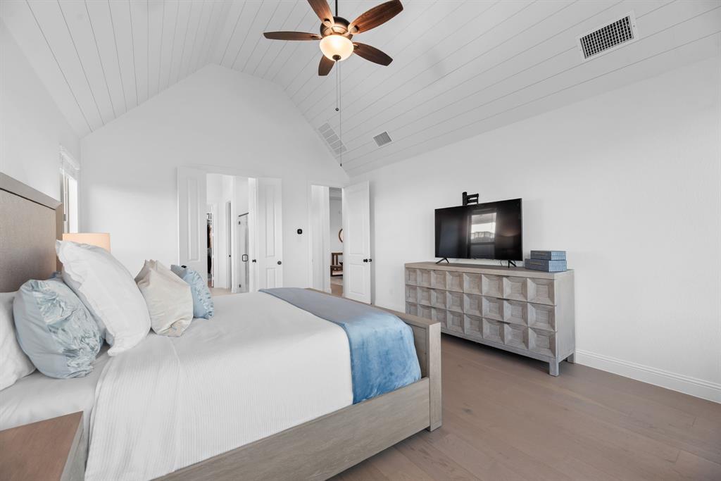 2248 Meander Way Northlake, TX 76247 - Photo 18 of 40 a bedroom with a bed and a flat screen tv