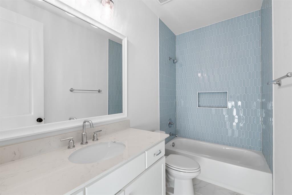 2248 Meander Way Northlake, TX 76247 - Photo 26 of 40 a bathroom with a sink a toilet and shower