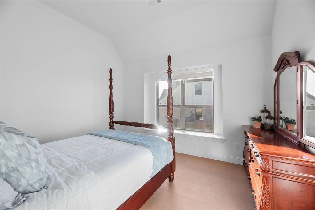 2248 Meander Way Northlake, TX 76247 - Photo 27 of 40 a bedroom with a bed mirror and window