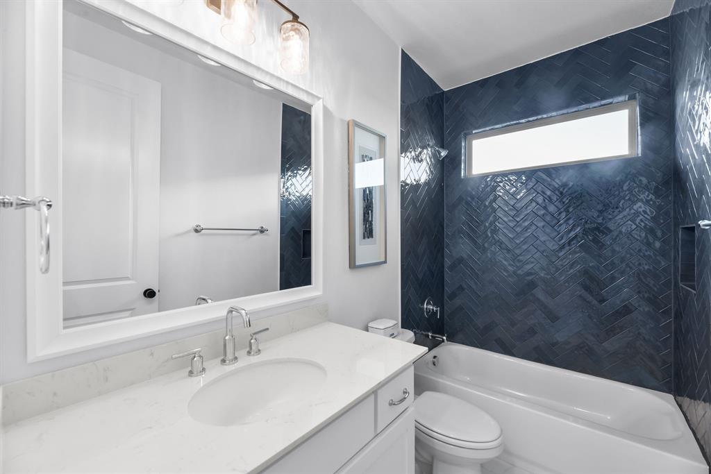 2248 Meander Way Northlake, TX 76247 - Photo 28 of 40 a bathroom with a sink a toilet and shower