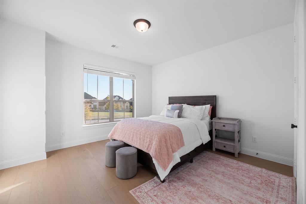 2248 Meander Way Northlake, TX 76247 - Photo 29 of 40 a bedroom with a bed and window
