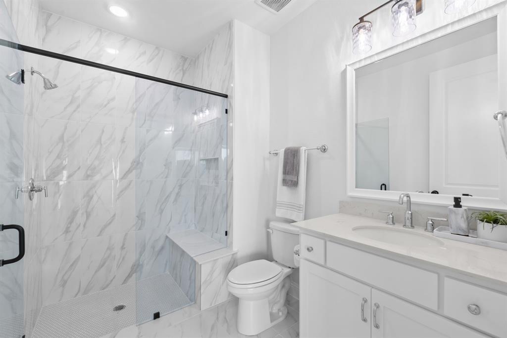 2248 Meander Way Northlake, TX 76247 - Photo 31 of 40 a bathroom with a sink a toilet and shower