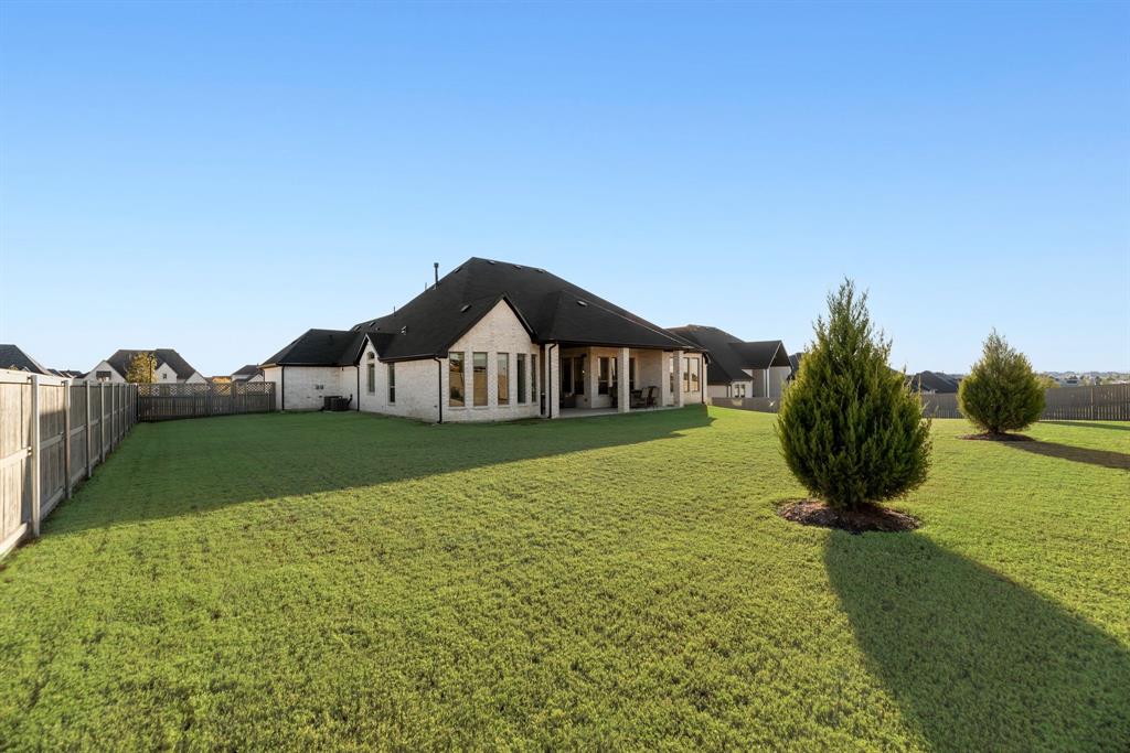 2248 Meander Way Northlake, TX 76247 - Photo 34 of 40 a front view of a house with garden