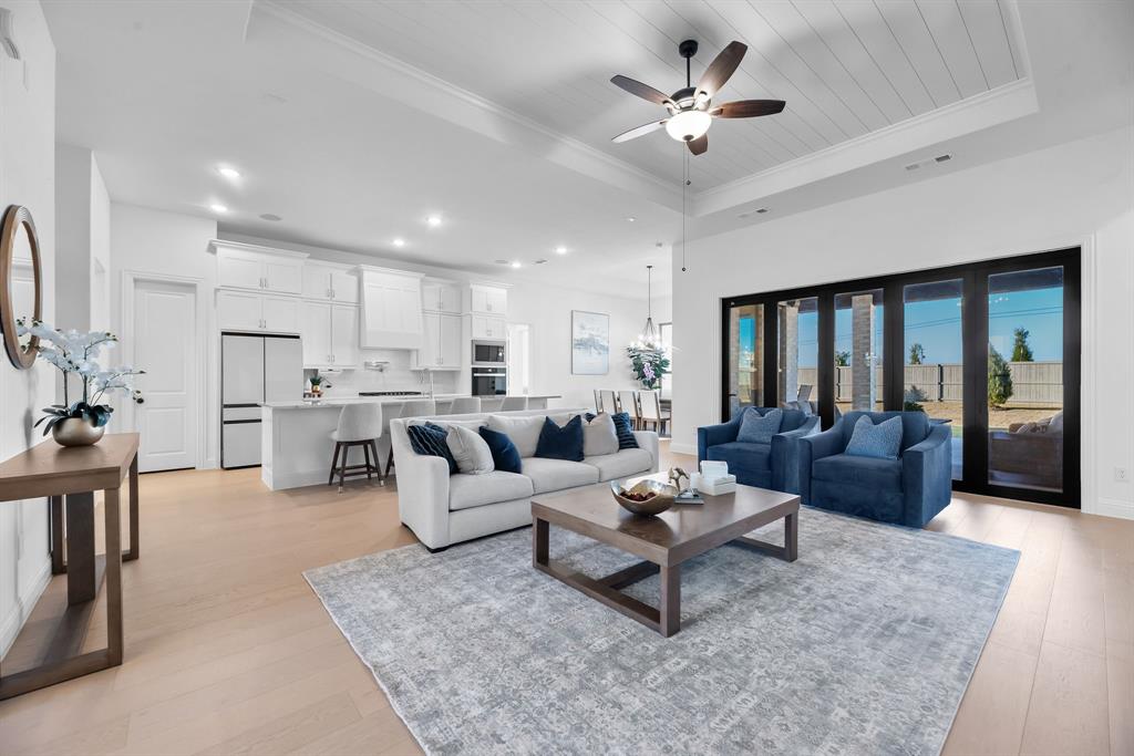 2248 Meander Way Northlake, TX 76247 - Photo 7 of 40 a living room with furniture kitchen view and a chandelier