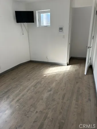 a bathroom with a granite countertop sink toilet a mirror and shower