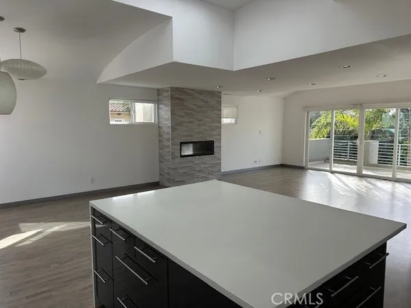 a kitchen with stainless steel appliances granite countertop a sink dishwasher stove and oven with wooden floor