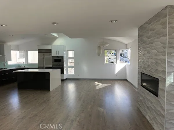 a view of a chairs and table in backyard
