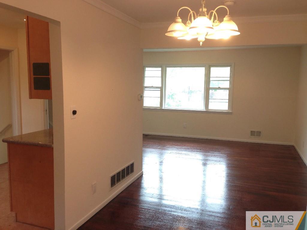17 Moryan Road Edison, NJ 08817 - Photo 9 of 13 a view of an empty room with wooden floor and a window