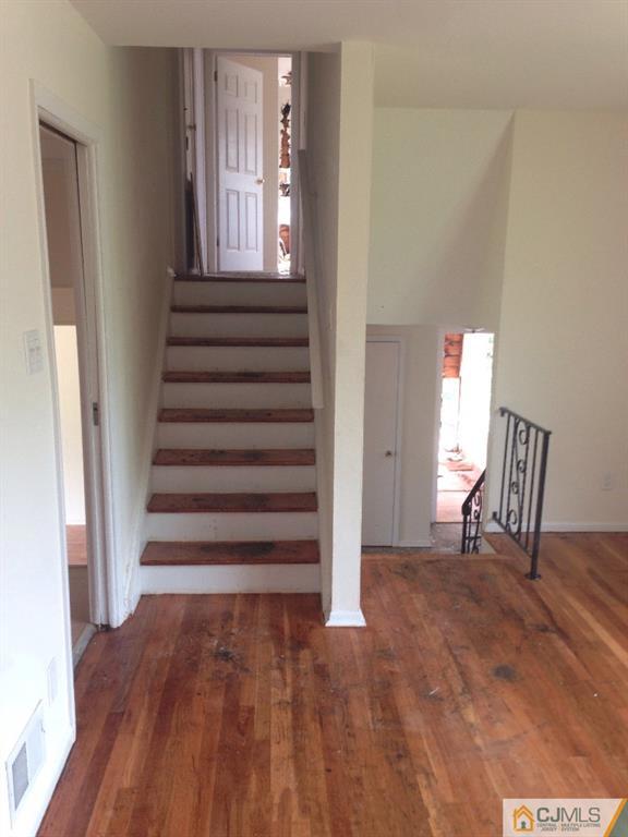 17 Moryan Road Edison, NJ 08817 - Photo 10 of 13 a view of entryway and hall with wooden floor