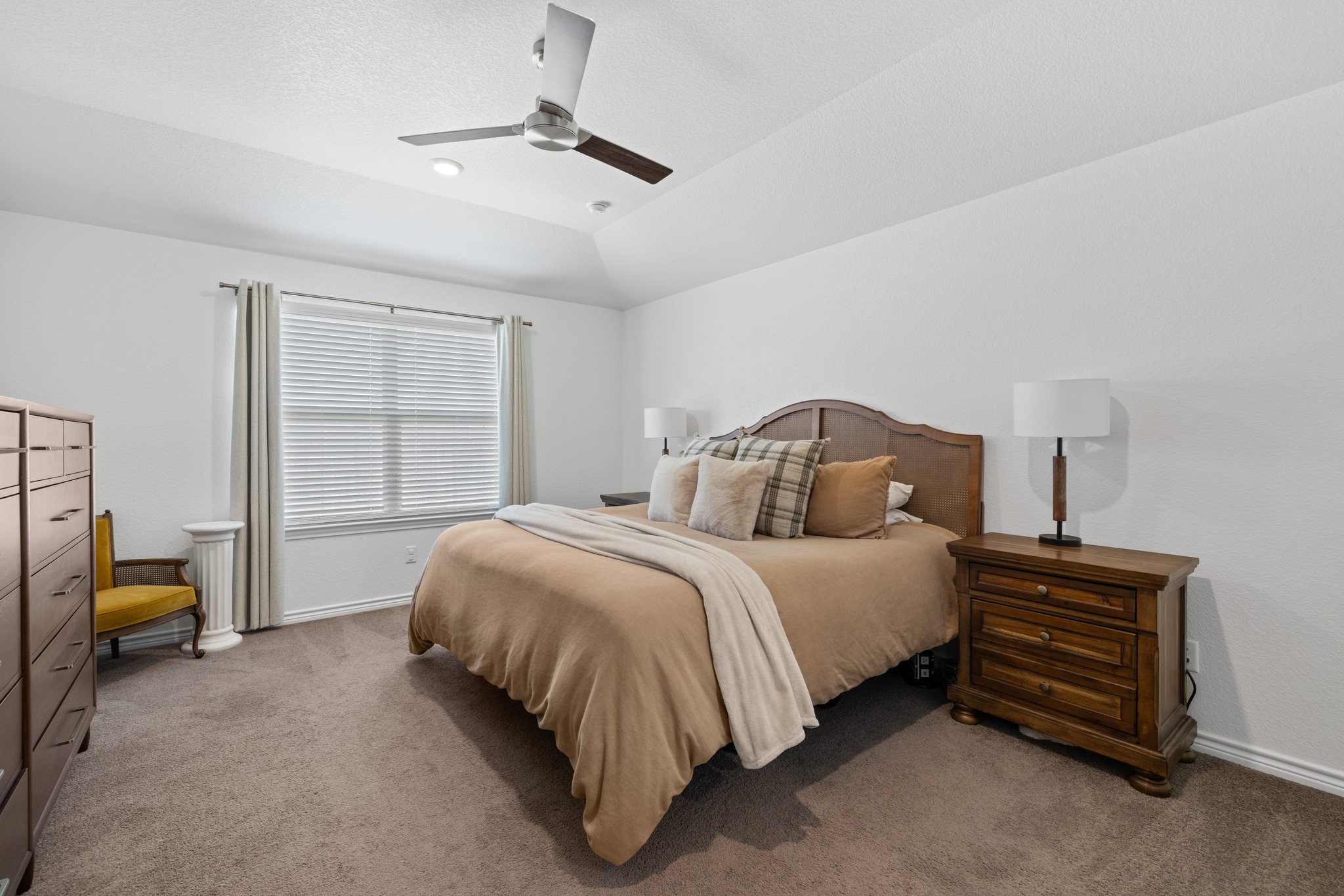 129 Maybelline Road Jarrell, TX 76537 - Photo 14 of 28 High vaulted ceilings and soft carpeting define this comfortable and relaxing bedroom retreat.