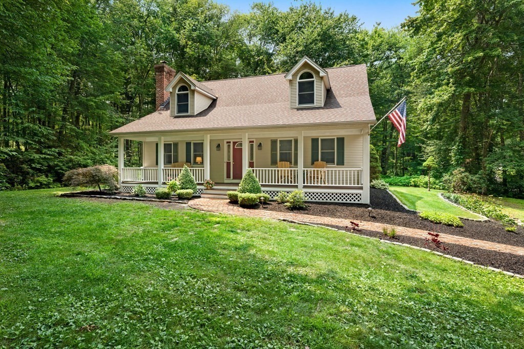 147 Wales Road Monson, MA 01057 - Photo 2 of 41 a front view of a house with a yard and trees