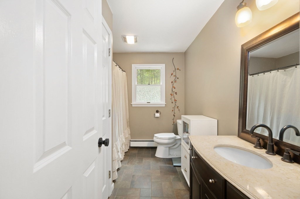147 Wales Road Monson, MA 01057 - Photo 30 of 41 a bathroom with a granite countertop sink toilet and shower