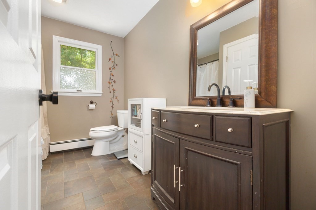 147 Wales Road Monson, MA 01057 - Photo 31 of 41 a bathroom with a toilet a sink and a mirror