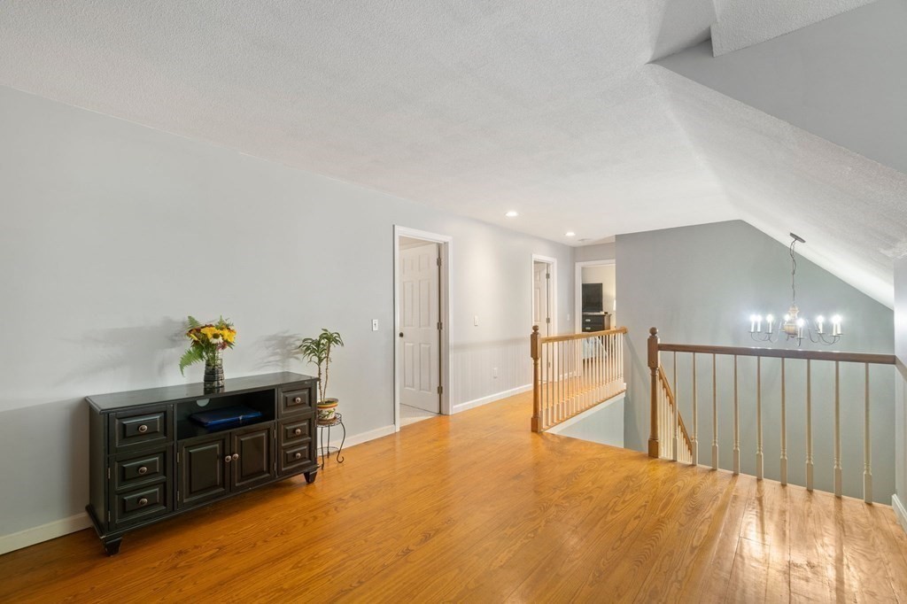 147 Wales Road Monson, MA 01057 - Photo 34 of 41 a living room with furniture and a wooden floor