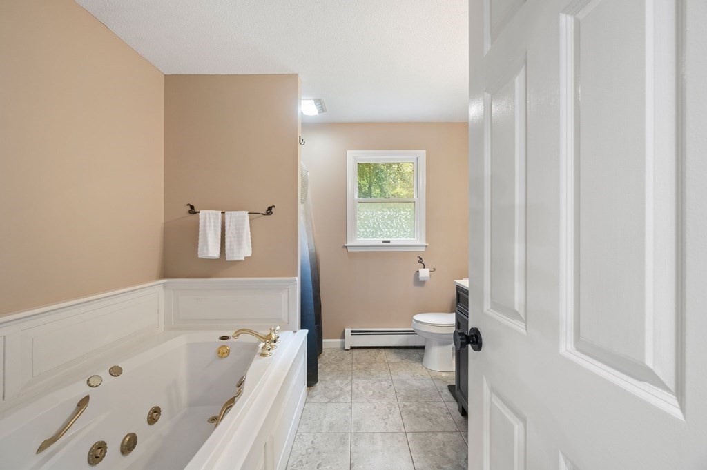 147 Wales Road Monson, MA 01057 - Photo 39 of 41 a bathroom with a bathtub and a toilet