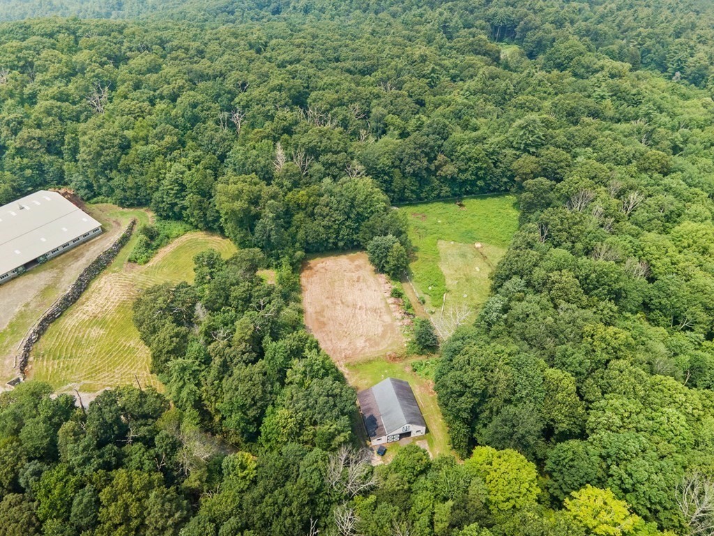 147 Wales Road Monson, MA 01057 - Photo 4 of 41 an aerial view of a house with a yard and large trees