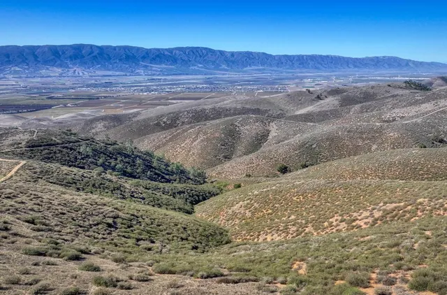 a view of ocean and mountain