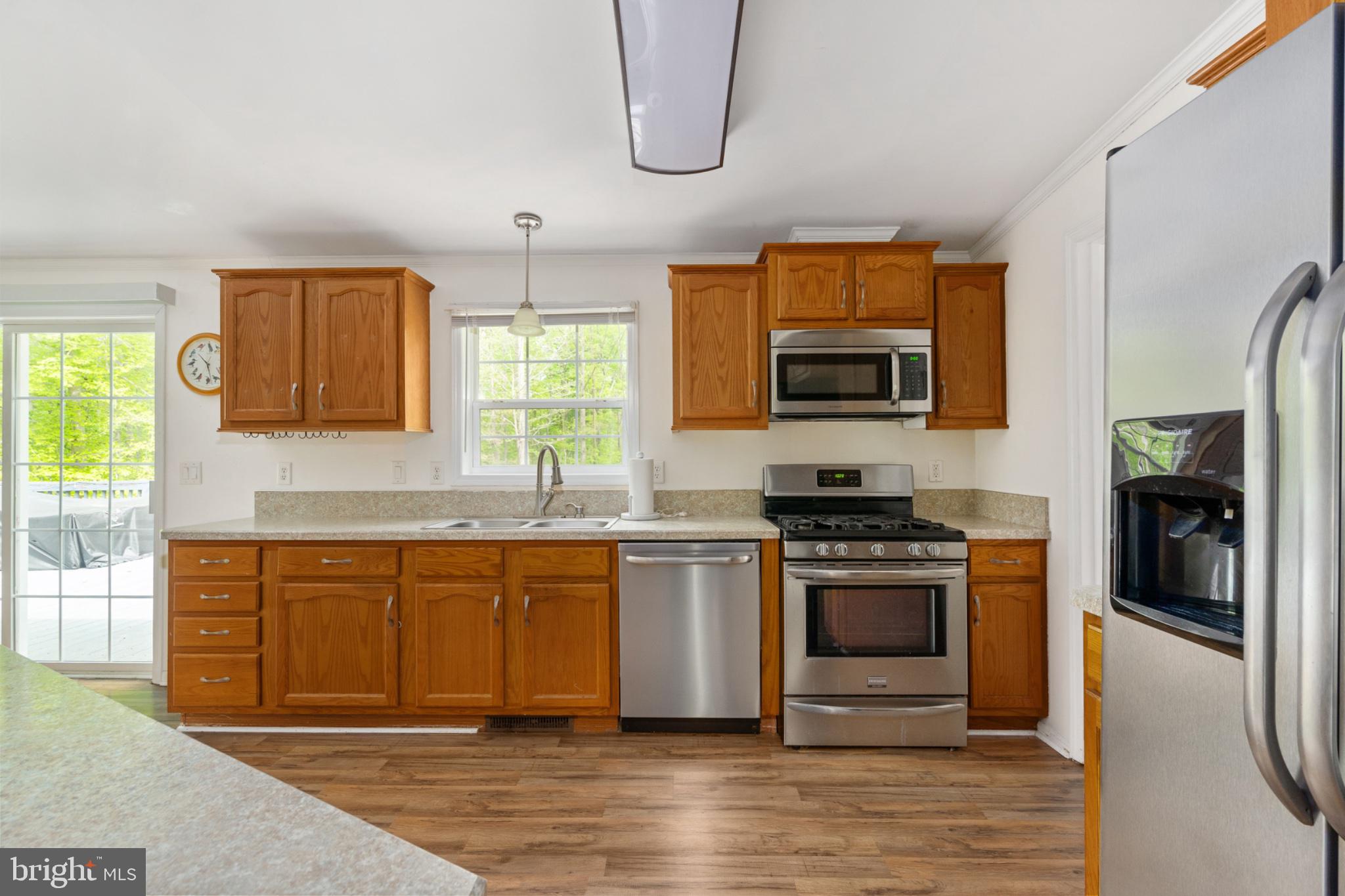 2319 Sizer Road Beaverdam, VA 23015 - Photo 28 of 61 a kitchen with stainless steel appliances granite countertop a stove and a sink
