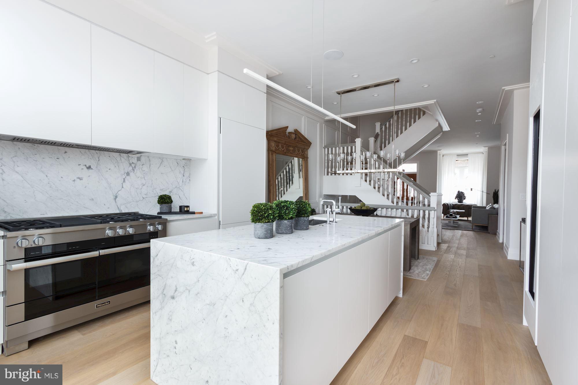 422 C Street Northeast Washington, DC 20002 - Photo 11 of 19 a kitchen with stainless steel appliances granite countertop a stove and a sink