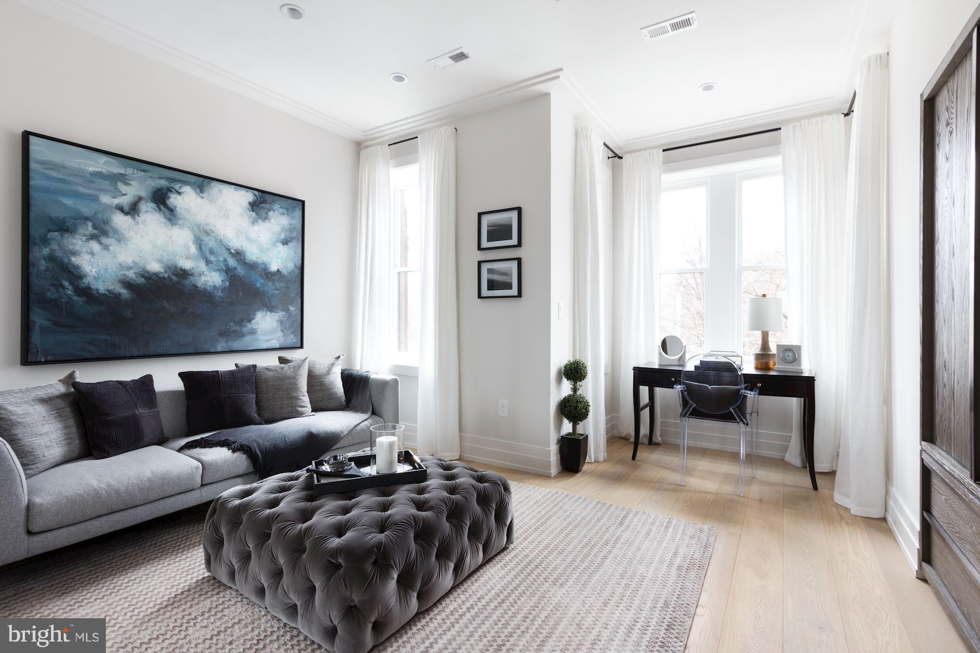 422 C Street Northeast Washington, DC 20002 - Photo 13 of 19 a living room with furniture and a large window