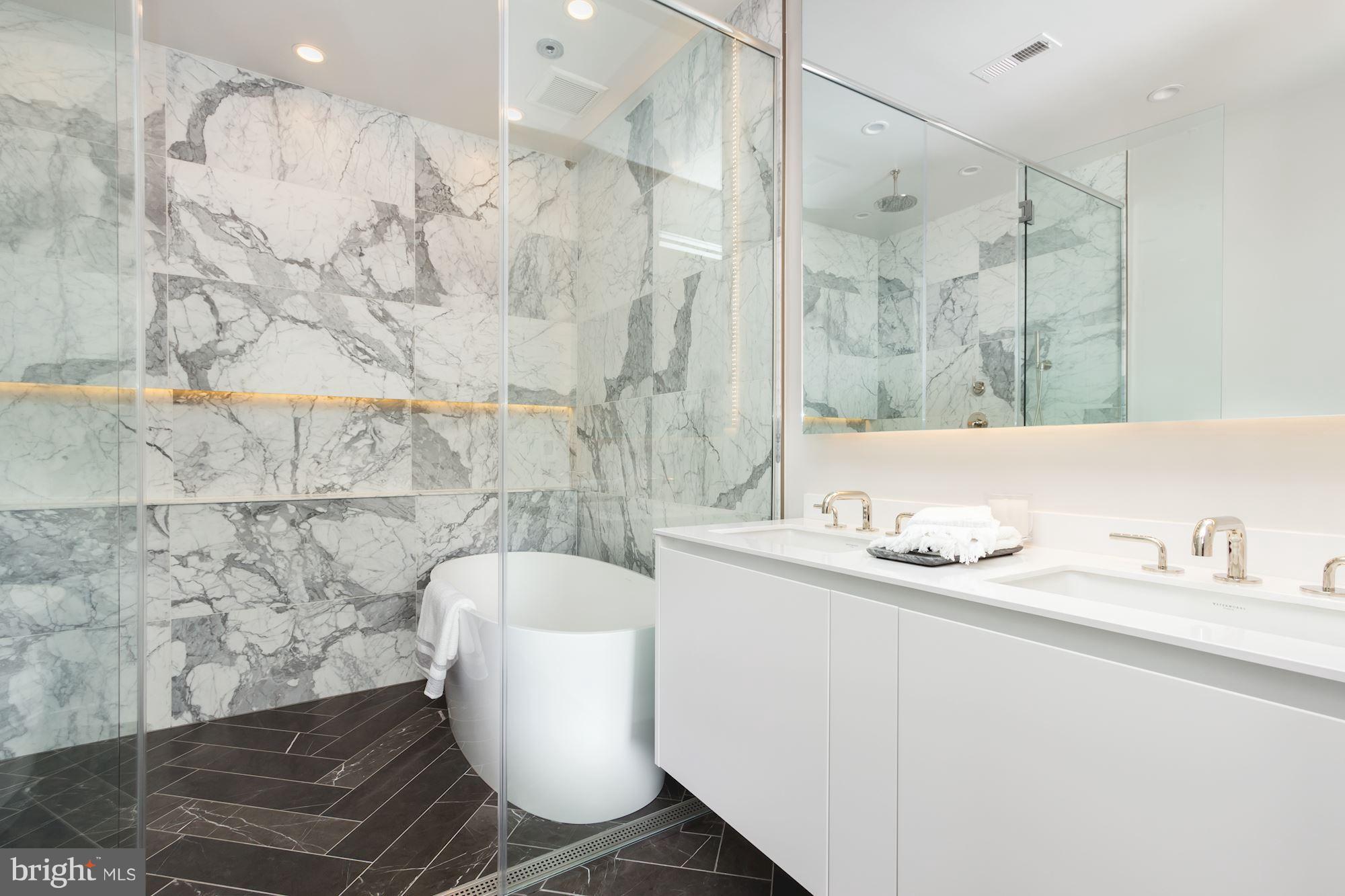 422 C Street Northeast Washington, DC 20002 - Photo 14 of 19 a bathroom with a sink and a mirror