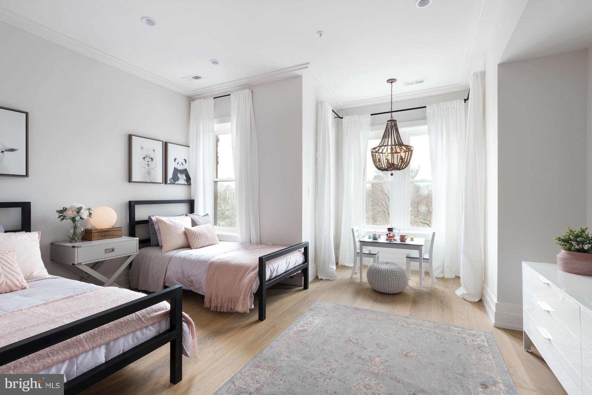 422 C Street Northeast Washington, DC 20002 - Photo 15 of 19 a very nice looking room with a large bed and a large window