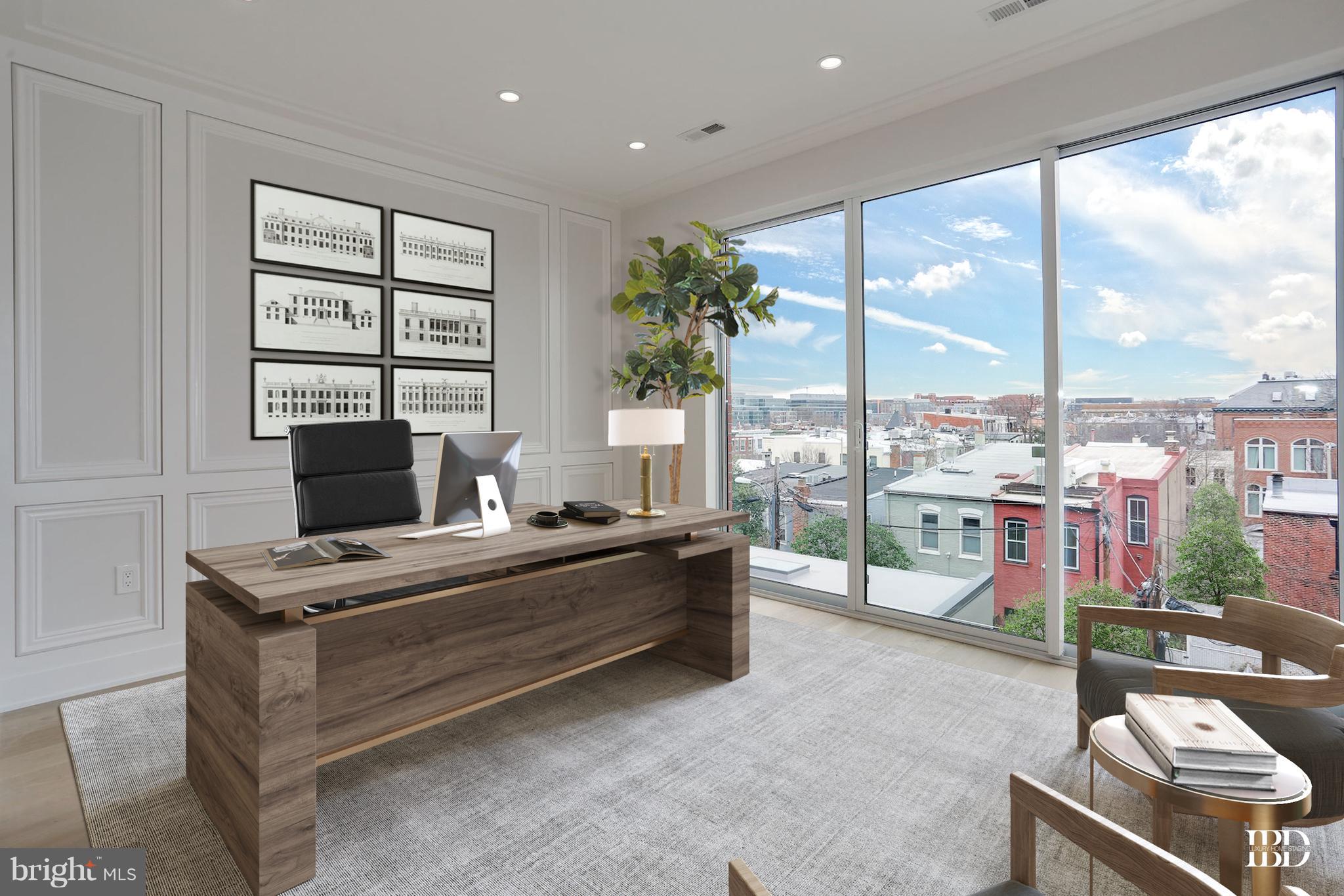 422 C Street Northeast Washington, DC 20002 - Photo 6 of 19 a living room with furniture a flat screen tv and a floor to ceiling window