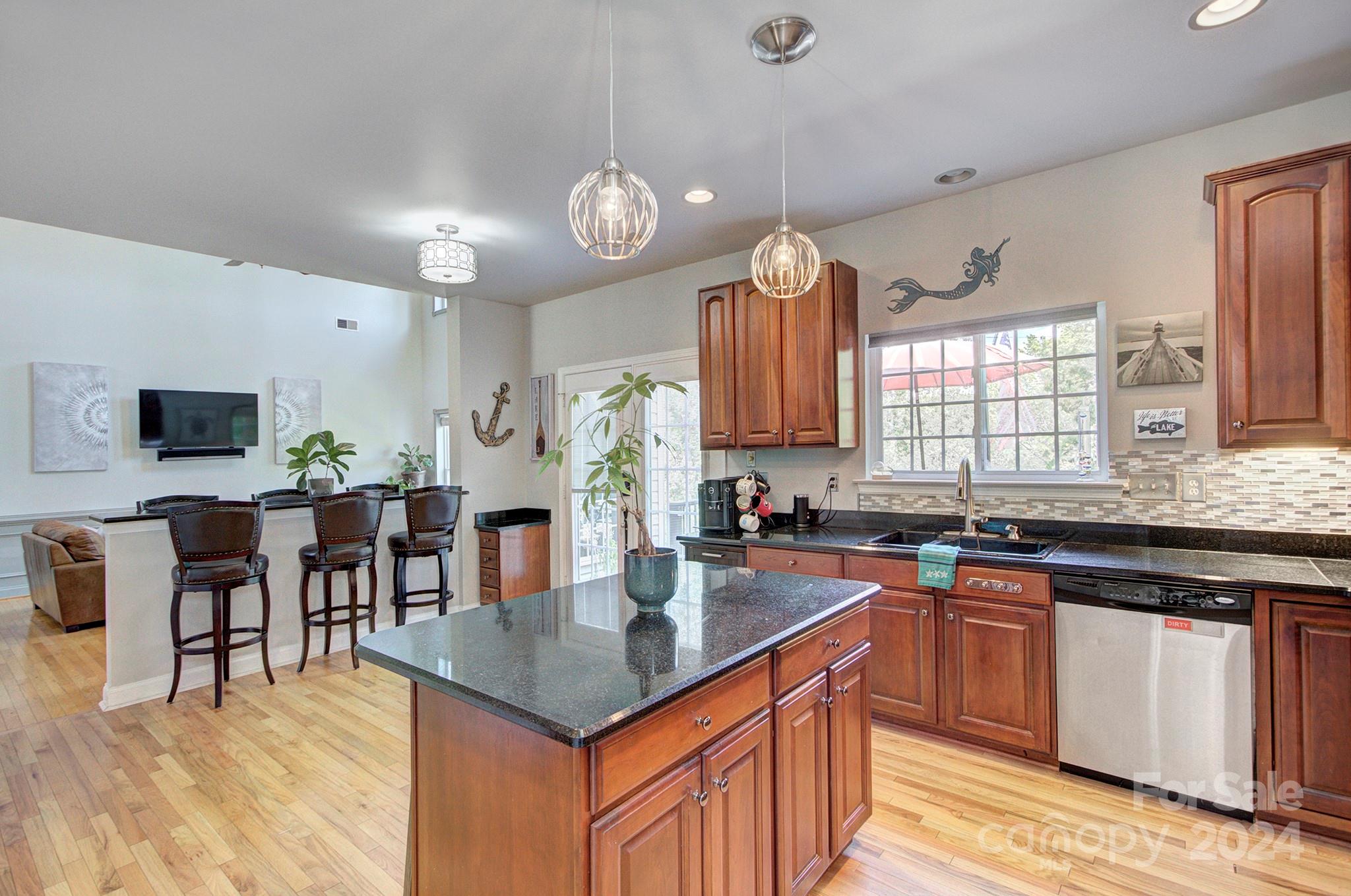 144 Lighthouse Road Mount Holly, NC 28120 - Photo 11 of 48 a kitchen with lots of counter space and dining table