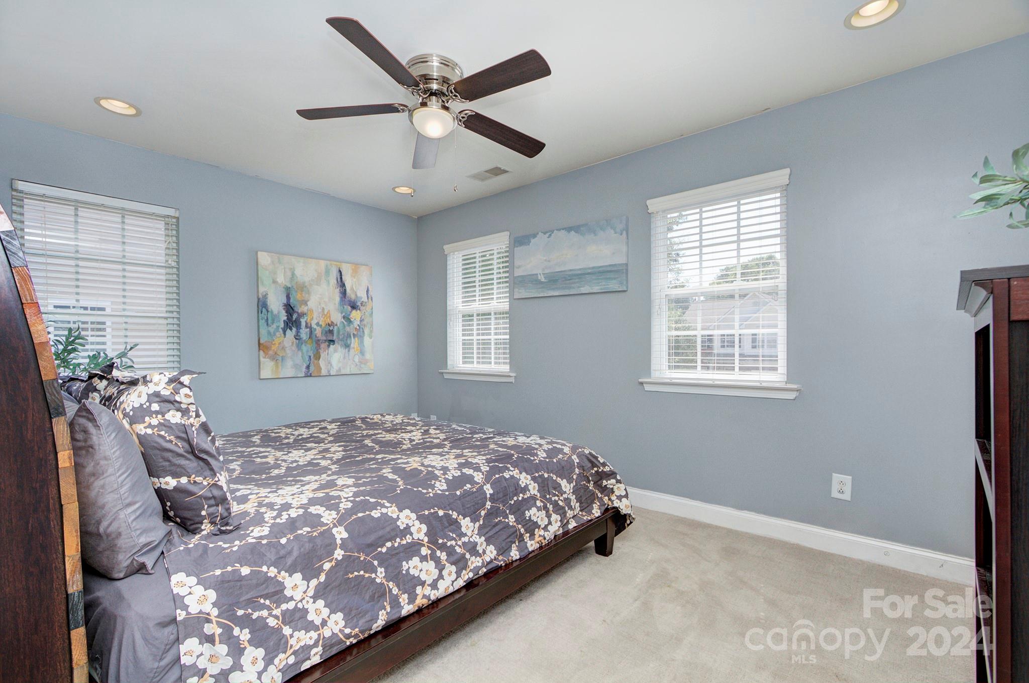 144 Lighthouse Road Mount Holly, NC 28120 - Photo 17 of 48 a bedroom with a large bed and a window