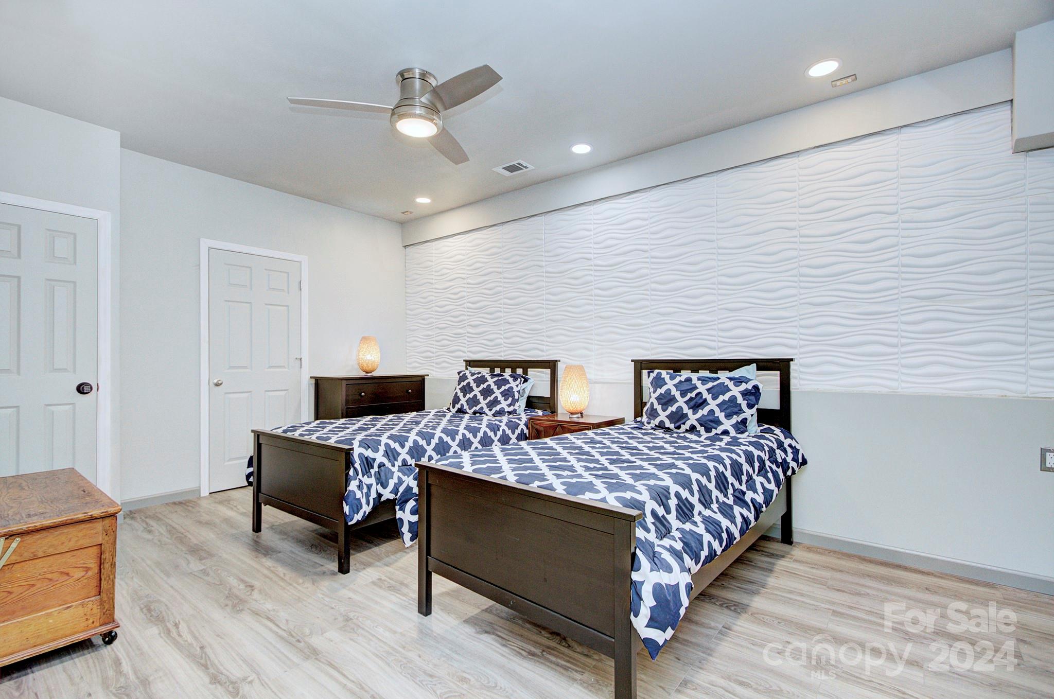 144 Lighthouse Road Mount Holly, NC 28120 - Photo 21 of 48 a bedroom with a bed and a chair
