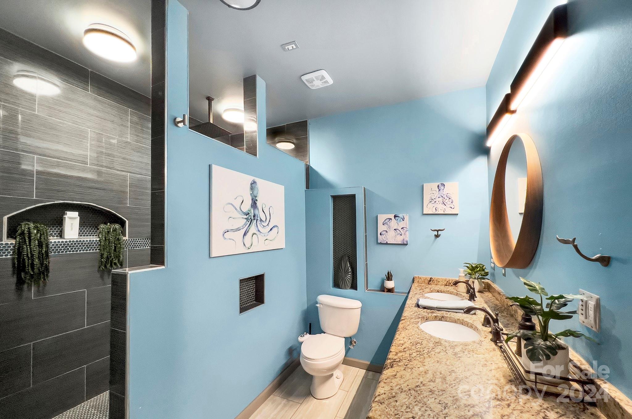 144 Lighthouse Road Mount Holly, NC 28120 - Photo 22 of 48 a bathroom with a toilet sink and mirror