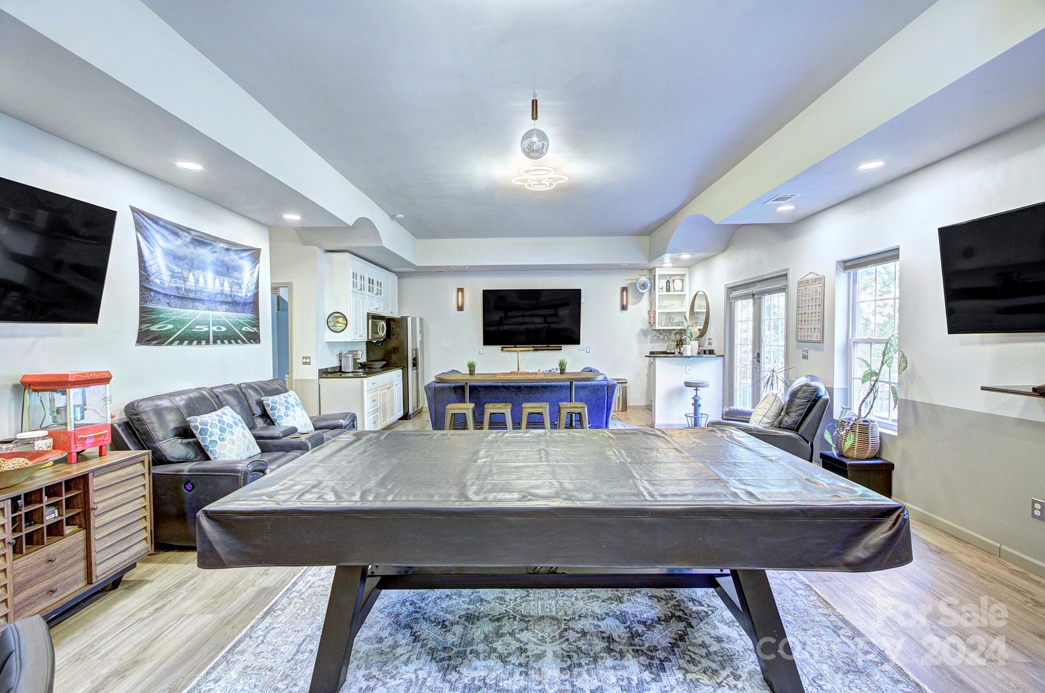 144 Lighthouse Road Mount Holly, NC 28120 - Photo 28 of 48 a living room with furniture and a flat screen tv
