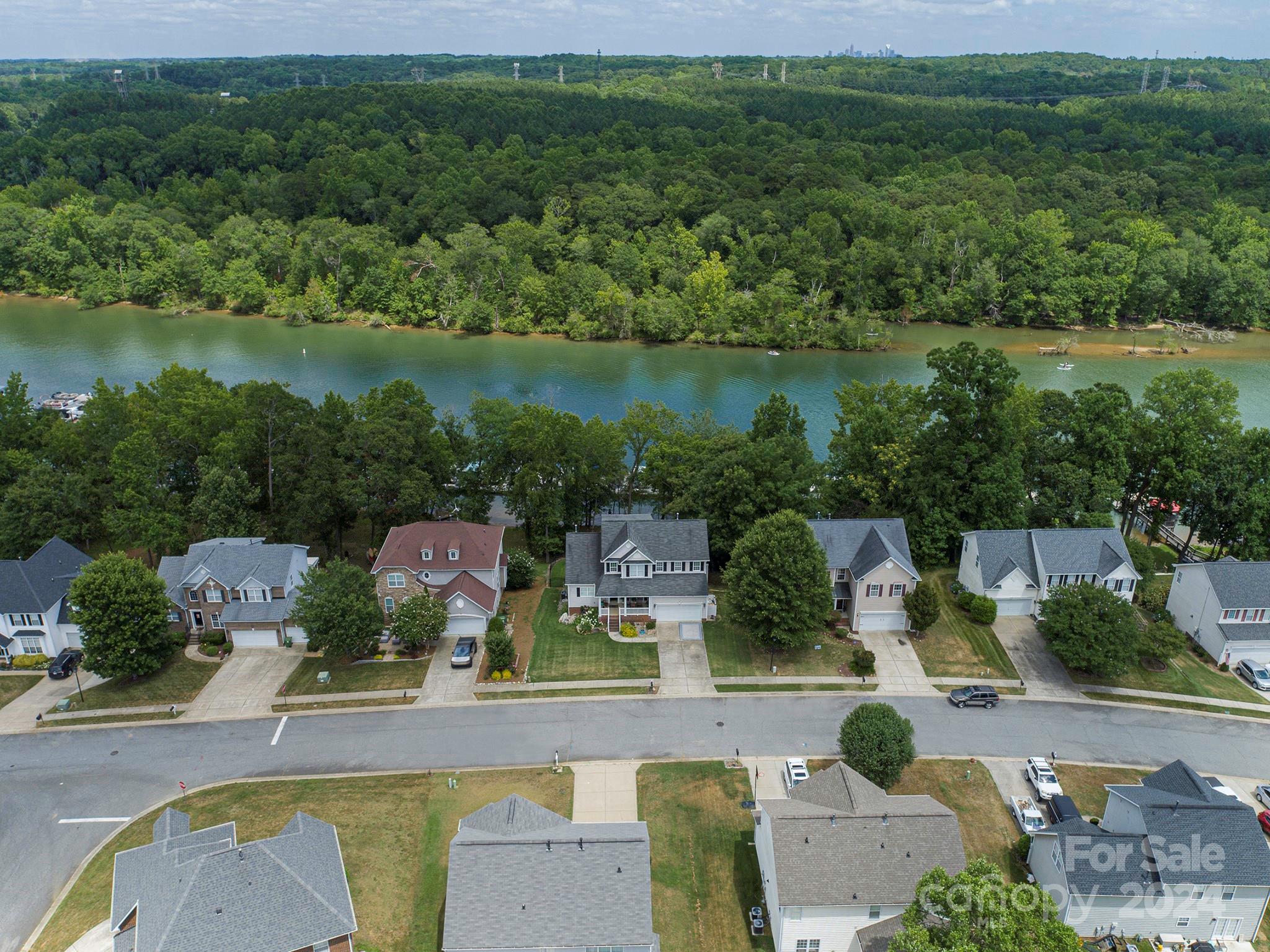 144 Lighthouse Road Mount Holly, NC 28120 - Photo 3 of 48 an aerial view of a house with lake view