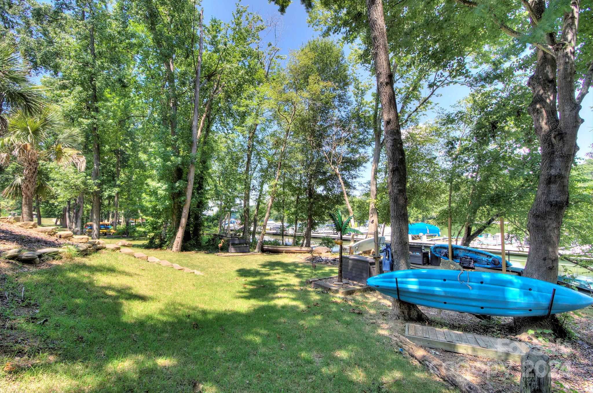 144 Lighthouse Road Mount Holly, NC 28120 - Photo 35 of 48 a view of a swimming pool with a patio