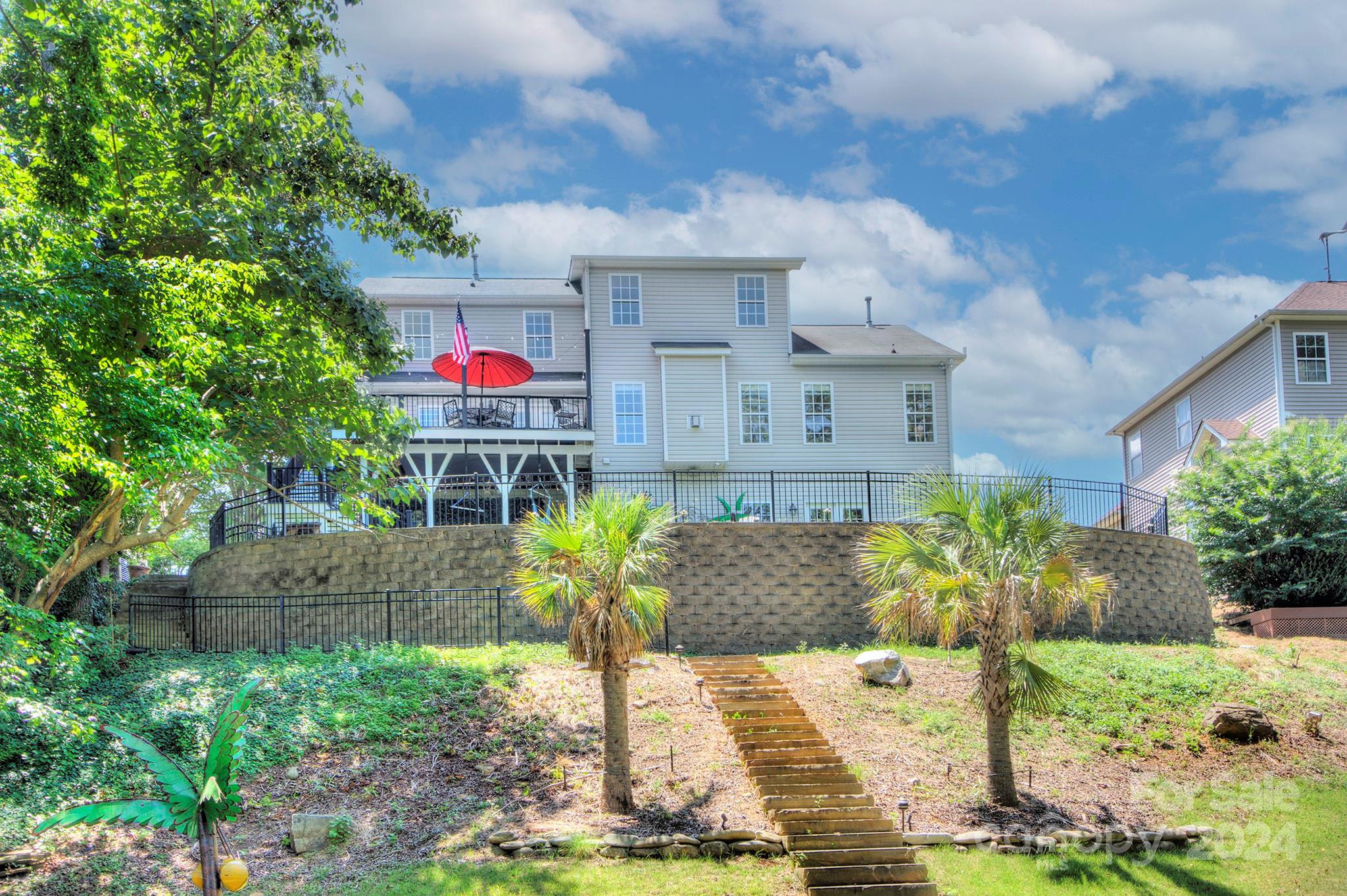 144 Lighthouse Road Mount Holly, NC 28120 - Photo 38 of 48 a front view of a house with garden