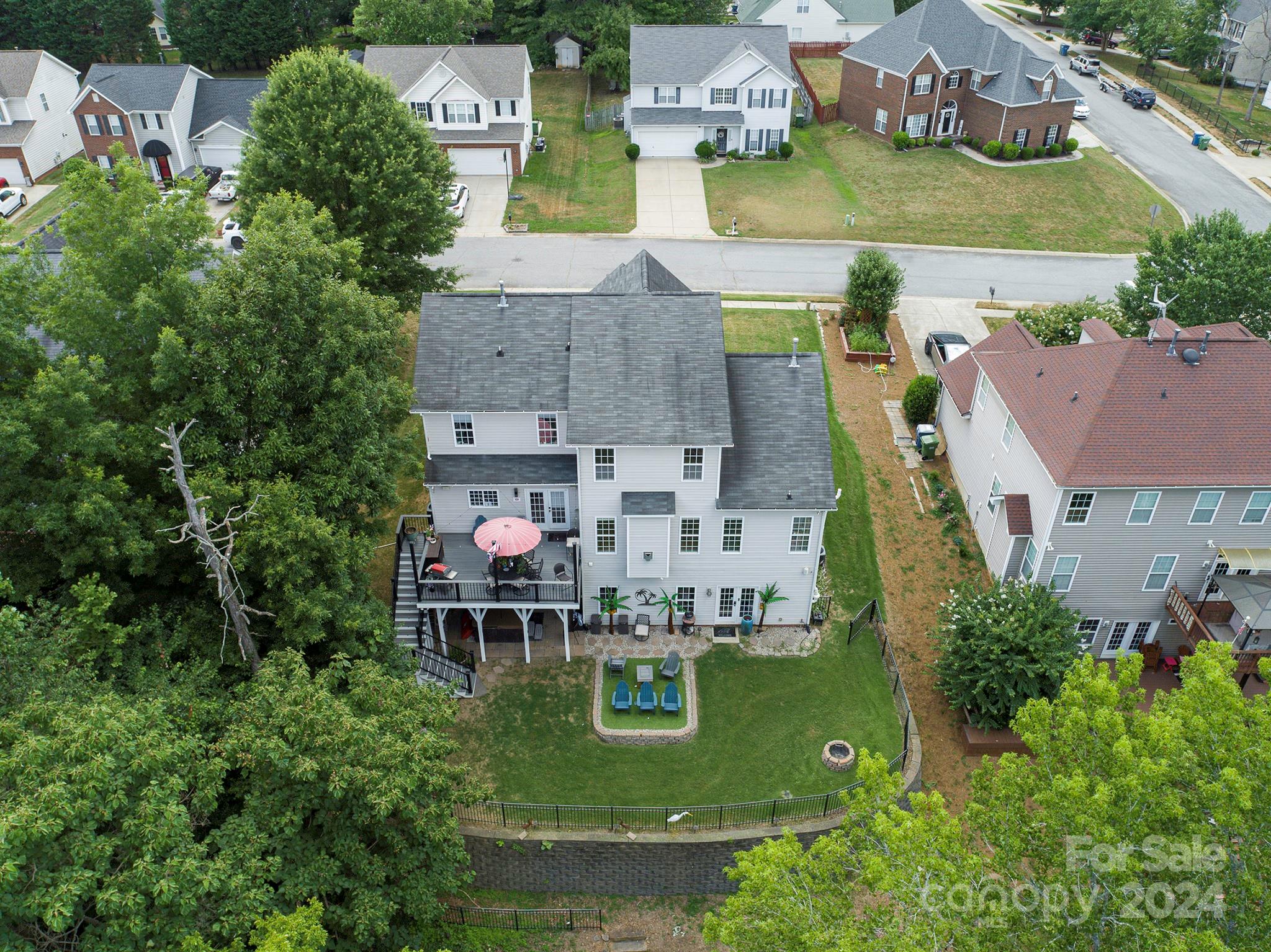 144 Lighthouse Road Mount Holly, NC 28120 - Photo 39 of 48 an aerial view of multiple houses with yard