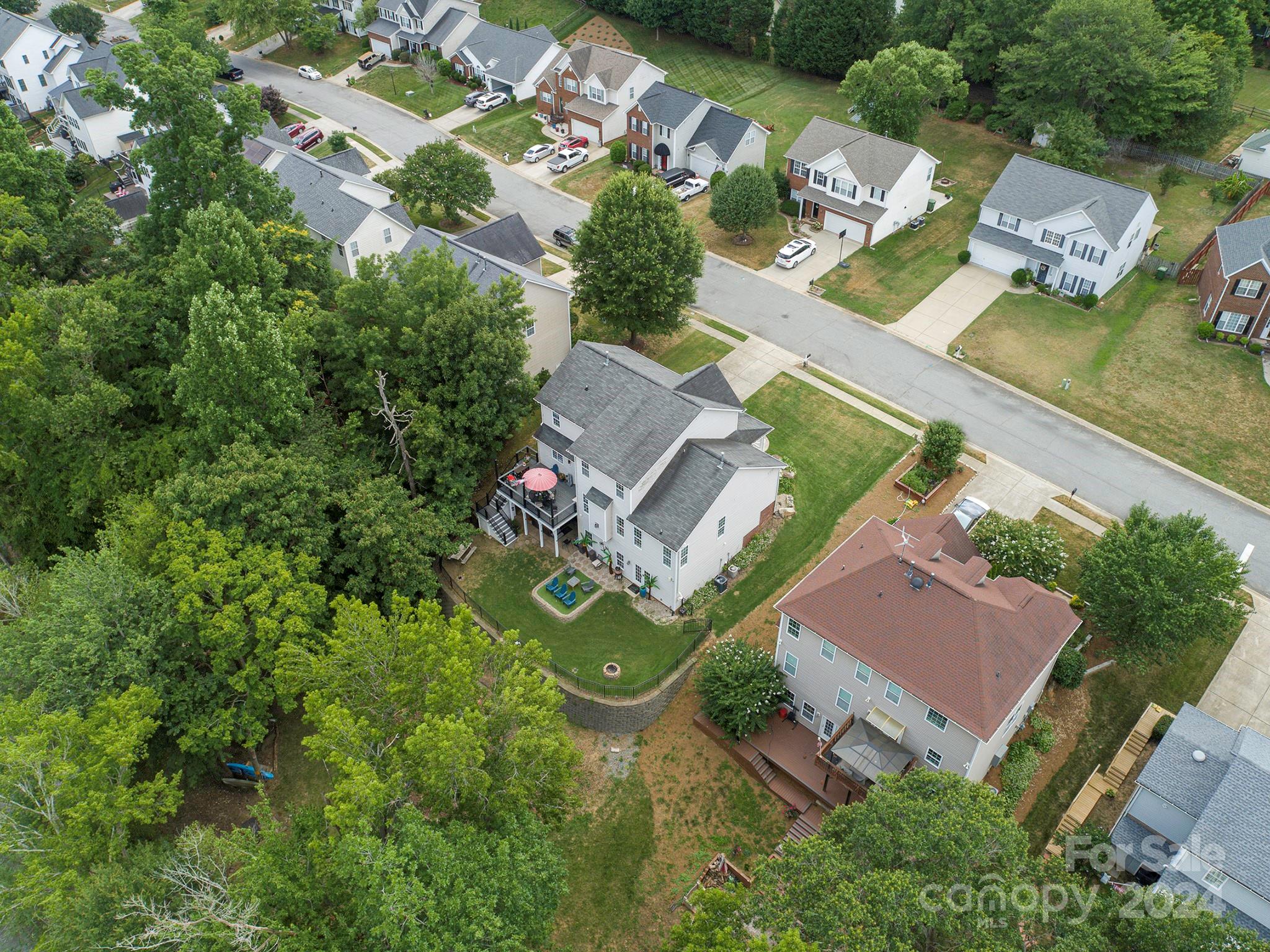 144 Lighthouse Road Mount Holly, NC 28120 - Photo 41 of 48 an aerial view of a house with garden space and street view