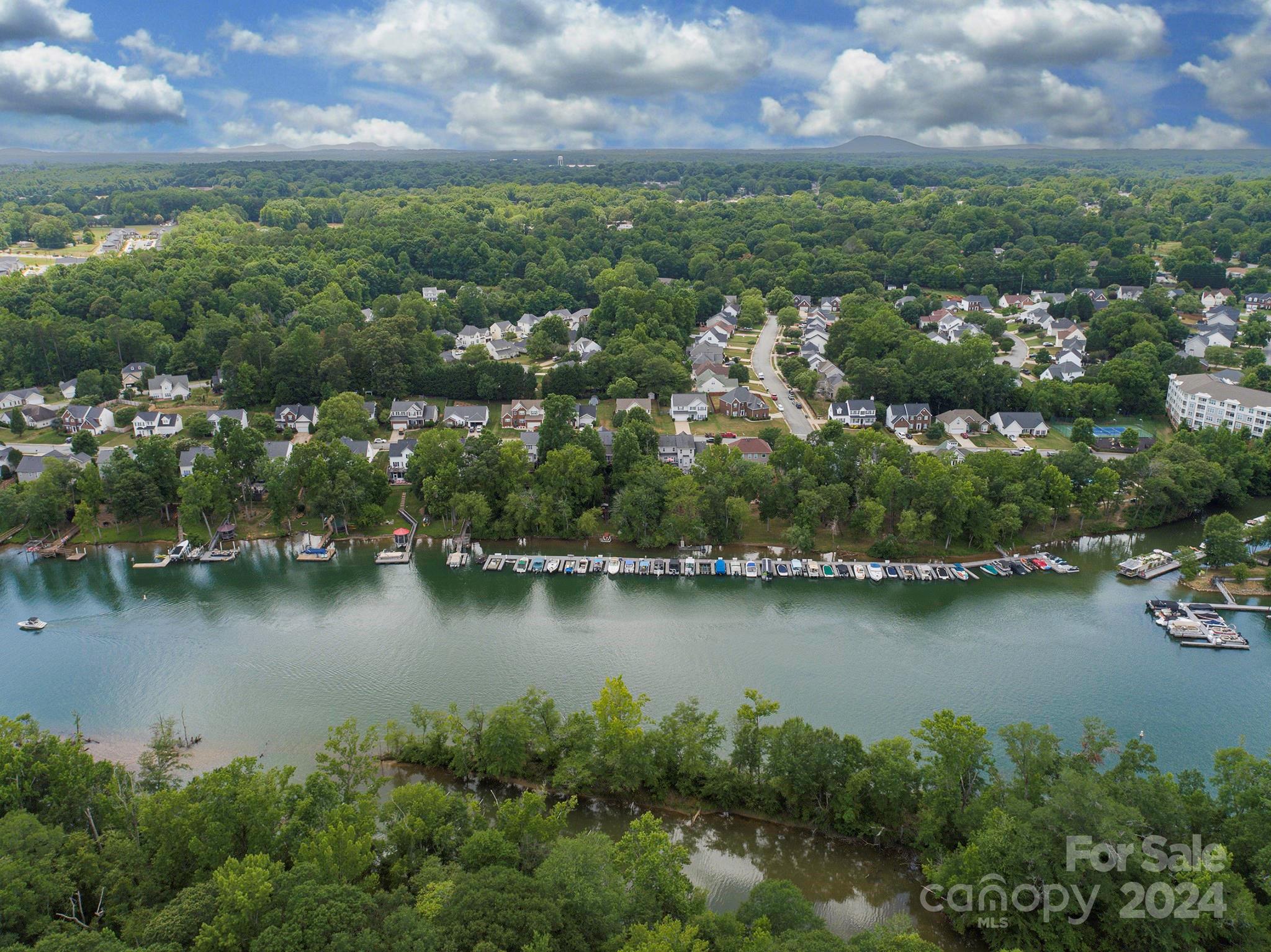 144 Lighthouse Road Mount Holly, NC 28120 - Photo 43 of 48 an aerial view of residential houses with outdoor space and lake view