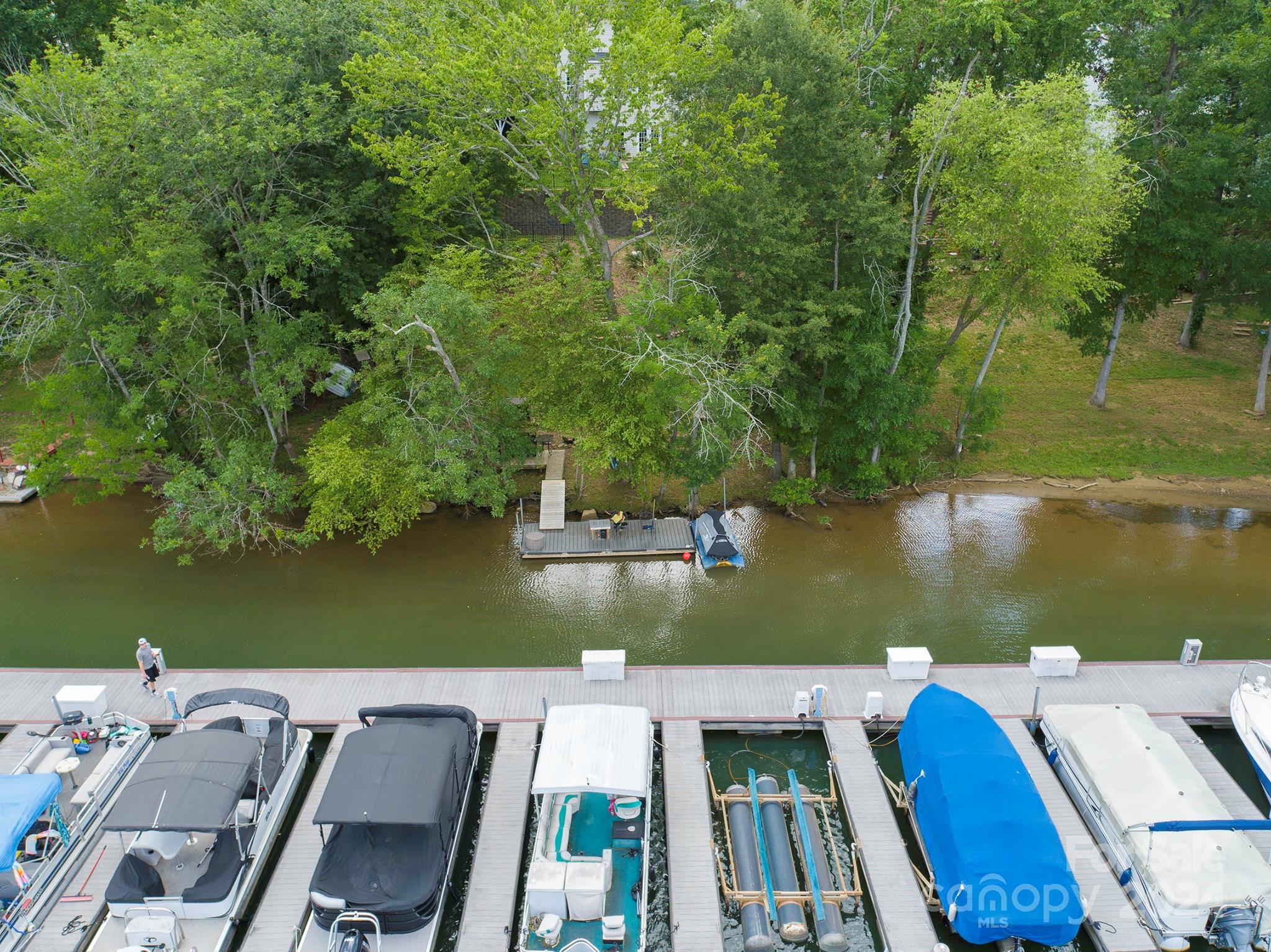 144 Lighthouse Road Mount Holly, NC 28120 - Photo 47 of 48 an aerial view of a house with outdoor space lake view and tall trees
