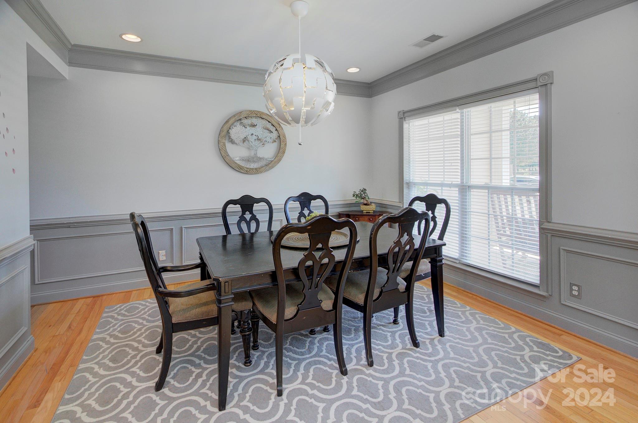 144 Lighthouse Road Mount Holly, NC 28120 - Photo 6 of 48 a view of a dining room with furniture window and wooden floor