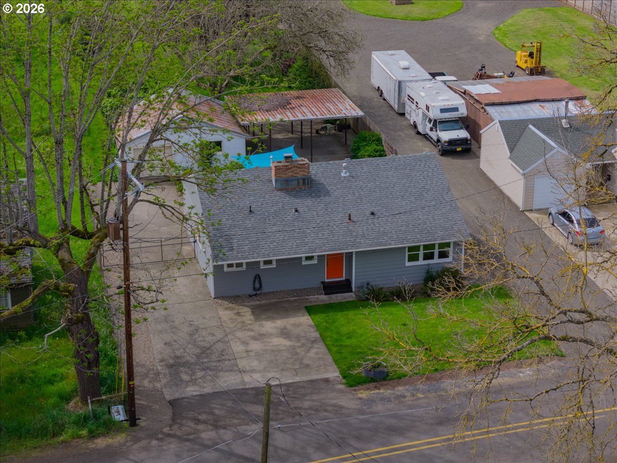 32973 Tennessee Road Southeast Lebanon, OR 97355 - Photo 35 of 36 an aerial view of a house with a garden and a yard